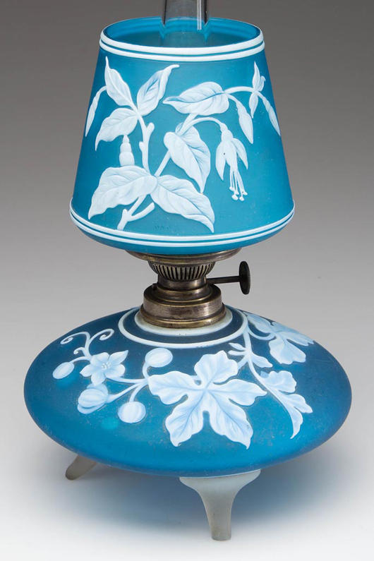 Estimated at $6,000-$9,000, the rare cameo Fuchsia Glory and Leaf pattern art glass miniature lamp sold for $8,625. Jeffrey S. Evans & Associates image.