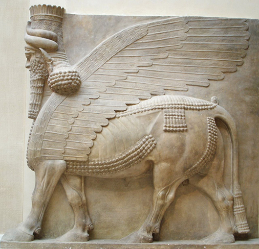 Lamassu, a human-headed winged bull, is a relief from King Sargon II's palace at Dur Sharrukin in Assyria (now Khorsabad in Iraq), ca. 713–716 B.C. It is in the collection of the Louvre Museum in Paris. Image by Marie-Lan Nguyen, courtesy of Wikimedia Commons.